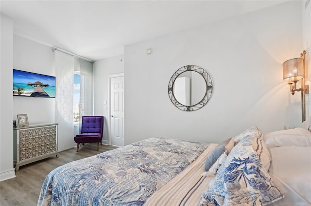 bedroom with wood finished floors