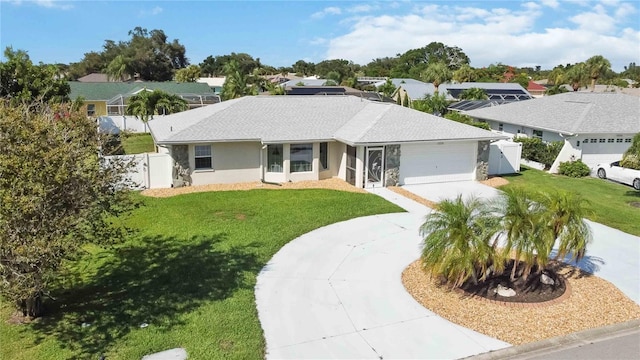 single story home featuring a garage and a front yard