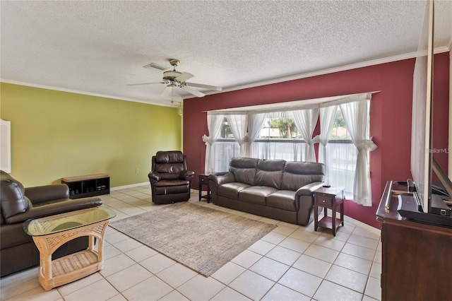 living room with light tile patterned flooring, ornamental molding, a textured ceiling, and ceiling fan