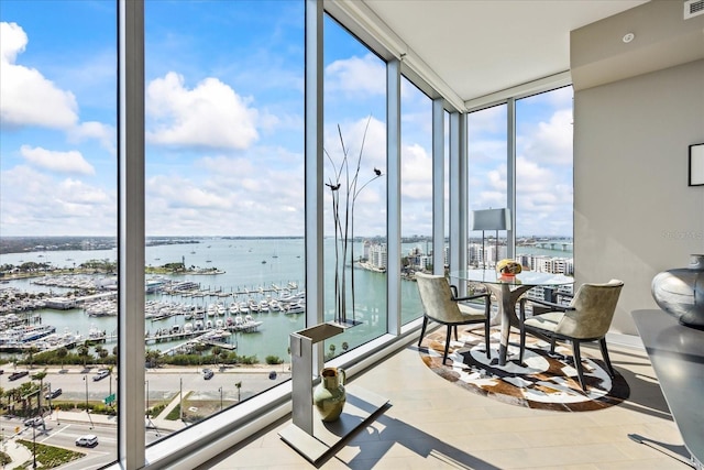 sunroom / solarium with a water view