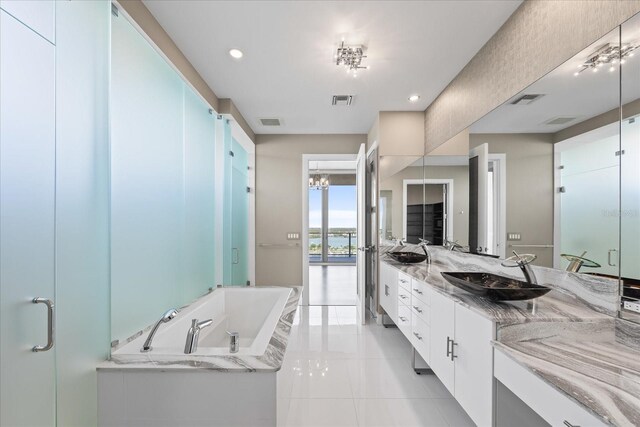 1155 N Gulfstream Ave Unit 1709, Sarasota, FL 34236 - full bathroom with double vanity, a bath, tile patterned flooring, a shower stall, and recessed lighting