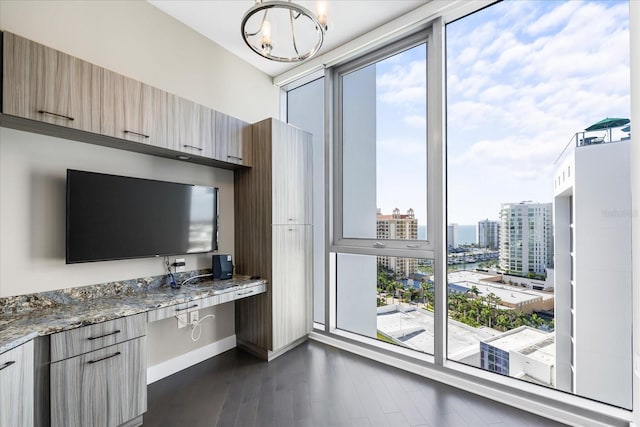 1155 N Gulfstream Ave Unit 1709, Sarasota, FL 34236 - office with plenty of natural light, dark wood-style flooring, a city view, and a chandelier