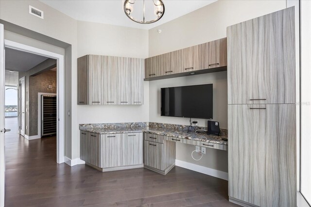 1155 N Gulfstream Ave Unit 1709, Sarasota, FL 34236 - kitchen featuring modern cabinets, dark wood-style flooring, light stone counters, and a chandelier