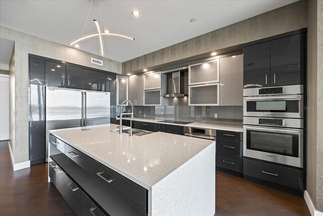1155 N Gulfstream Ave Unit 1709, Sarasota, FL 34236 - kitchen with wall chimney range hood, dark cabinetry, modern cabinets, black electric cooktop, and recessed lighting