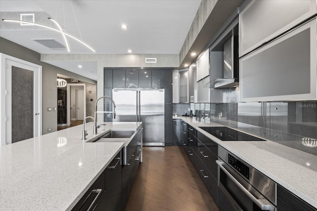 1155 N Gulfstream Ave Unit 1709, Sarasota, FL 34236 - kitchen with stainless steel appliances, modern cabinets, dark cabinetry, dark wood-style floors, and recessed lighting