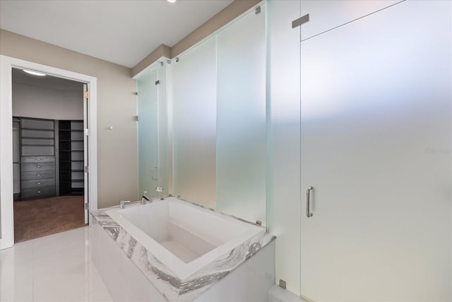 1155 N Gulfstream Ave Unit 1709, Sarasota, FL 34236 - full bathroom with a bath, a walk in closet, and tile patterned flooring