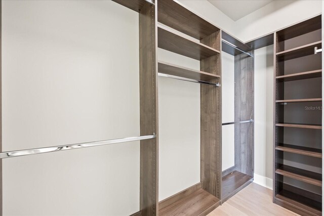 1155 N Gulfstream Ave Unit 1709, Sarasota, FL 34236 - walk in closet featuring wood finished floors