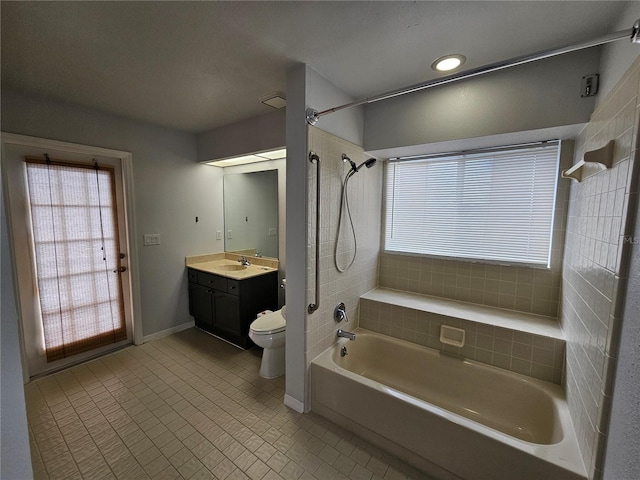 bathroom featuring shower / bathing tub combination, vanity, toilet, and a healthy amount of sunlight