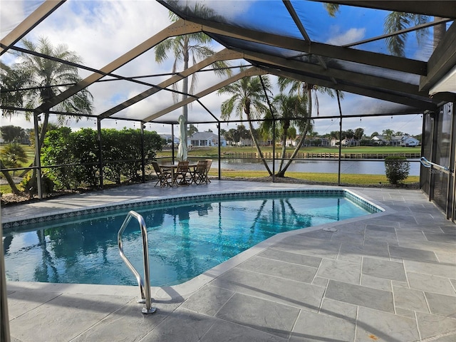 pool featuring a water view, a patio area, and a lanai