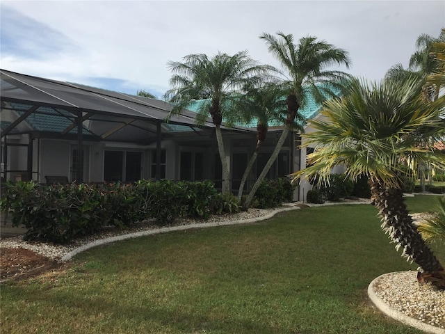 view of yard with a lanai