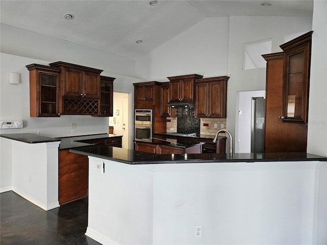 1211 Peridot Ln, Sun City Center, FL 33573 - kitchen featuring a peninsula, glass insert cabinets, high vaulted ceiling, backsplash, and stainless steel appliances