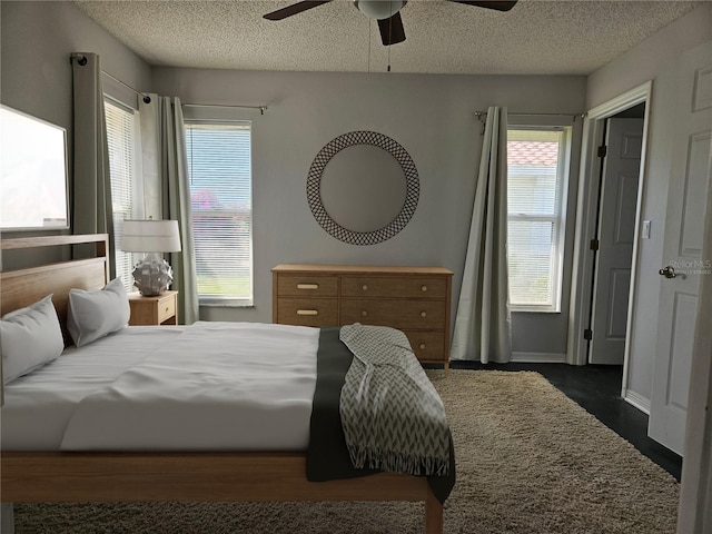1211 Peridot Ln, Sun City Center, FL 33573 - bedroom with a ceiling fan and a textured ceiling