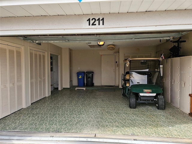 1211 Peridot Ln, Sun City Center, FL 33573 - garage featuring a garage door opener