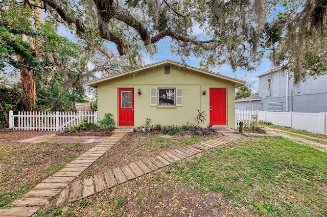 bungalow with a front yard