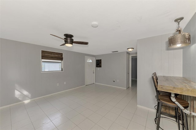 interior space featuring light tile patterned floors and ceiling fan