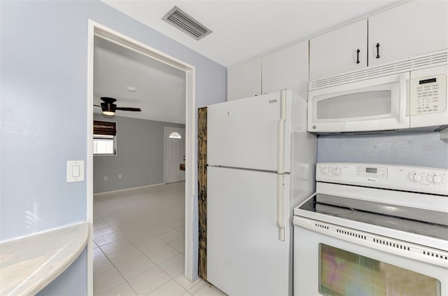 kitchen with white appliances, white cabinets, ceiling fan, and light tile patterned floors