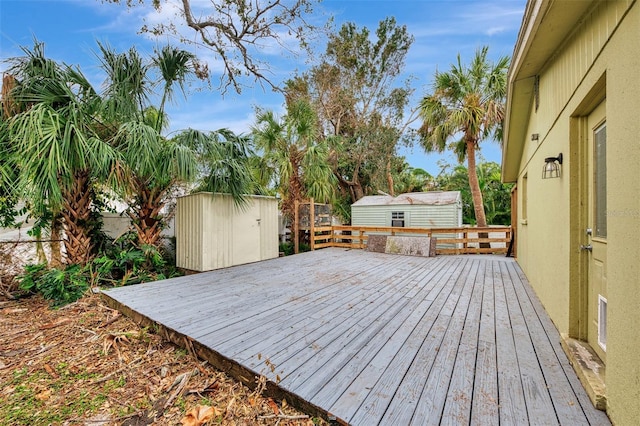 wooden terrace featuring a storage unit