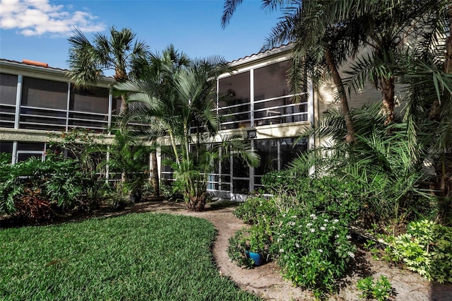 view of yard featuring a sunroom