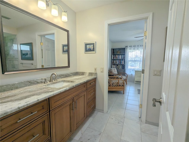 bathroom featuring ceiling fan and vanity