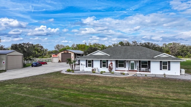 single story home with a garage, an outdoor structure, and a front lawn