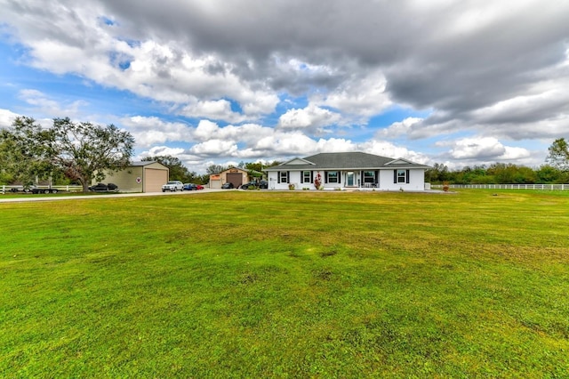 view of front of property featuring a garage and a front yard