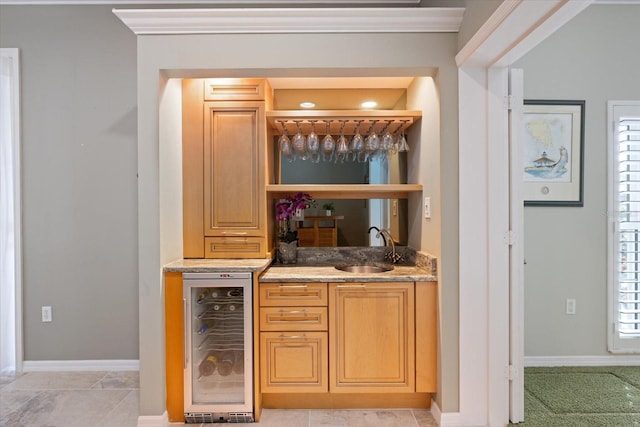 bar featuring sink and beverage cooler