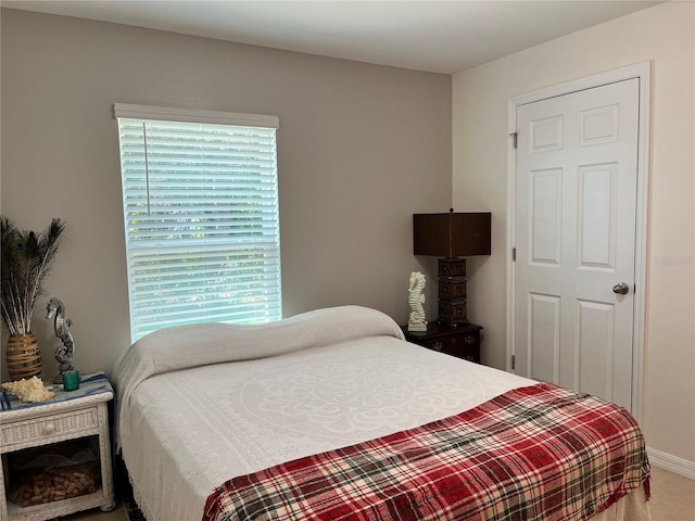 bedroom with multiple windows