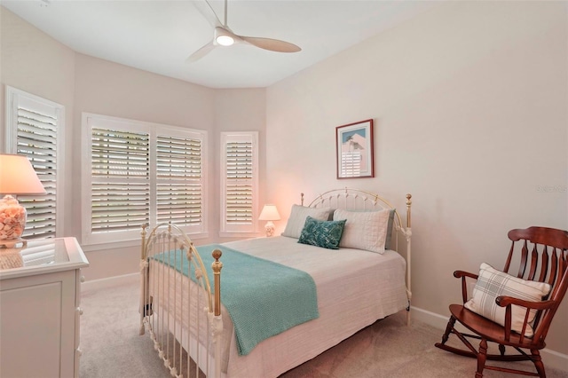 bedroom with light carpet and ceiling fan