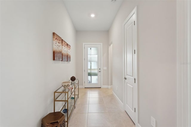 doorway featuring light tile patterned floors