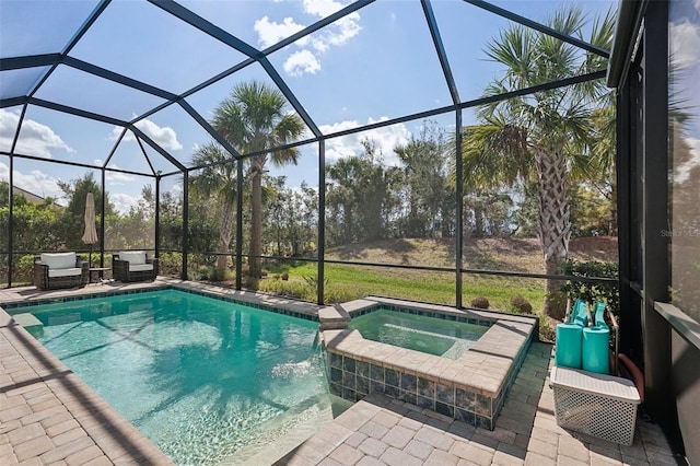 view of pool featuring an in ground hot tub, a lanai, and a patio area