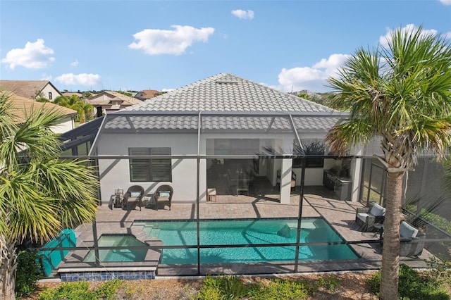 rear view of house featuring a patio and a lanai