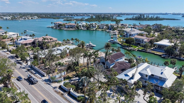 aerial view featuring a residential view and a water view