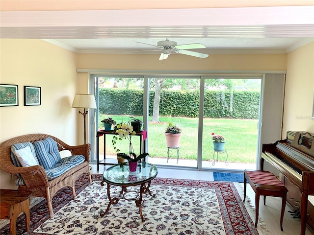 7649 Quinto Dr, Sarasota, FL 34238 - living room with crown molding, ceiling fan, and wood finished floors