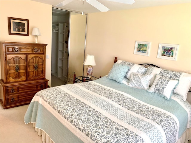 7649 Quinto Dr, Sarasota, FL 34238 - bedroom with a ceiling fan, light colored carpet, and a closet