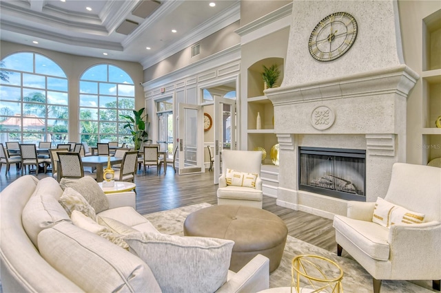 7649 Quinto Dr, Sarasota, FL 34238 - living room featuring crown molding, visible vents, a towering ceiling, recessed lighting, and coffered ceiling