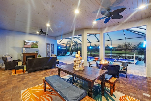 interior space with a lanai and an outdoor living space with a fire pit