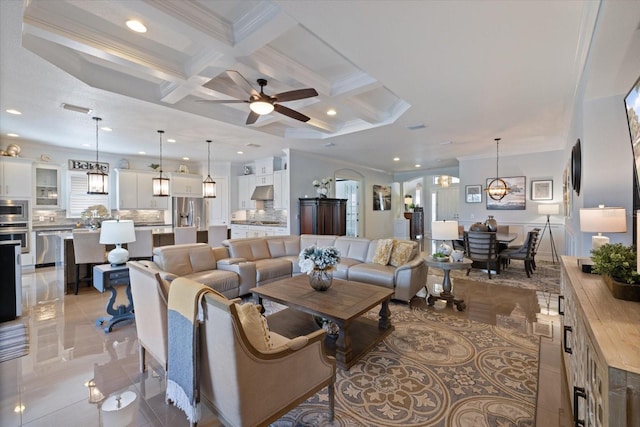 tiled living room with coffered ceiling, crown molding, beam ceiling, and ceiling fan