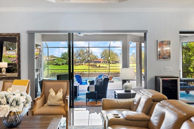 living room featuring ornamental molding and a wealth of natural light