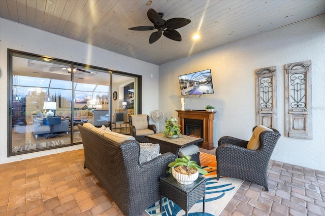 living room with wood ceiling and ceiling fan