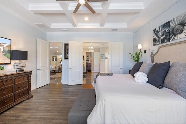 bedroom with coffered ceiling, ornamental molding, dark hardwood / wood-style flooring, beamed ceiling, and ceiling fan