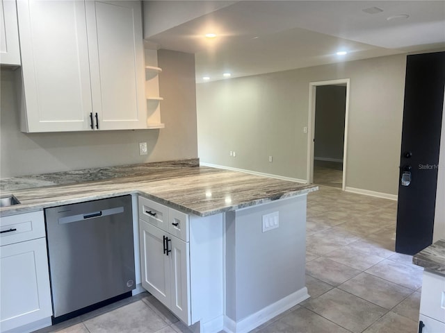 kitchen with white cabinets, light stone counters, open shelves, stainless steel dishwasher, and a peninsula