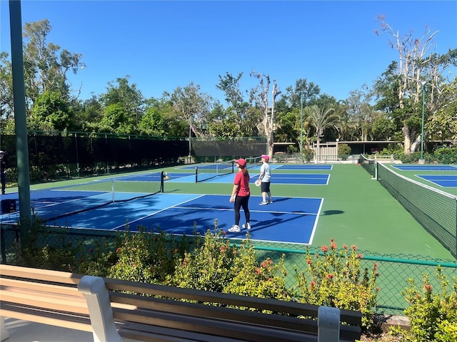 view of sport court with fence
