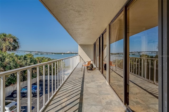 balcony featuring a water view