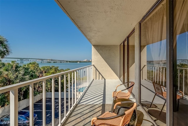 balcony featuring a water view