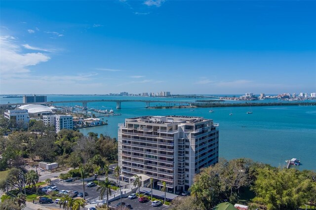 bird's eye view featuring a water view and a city view