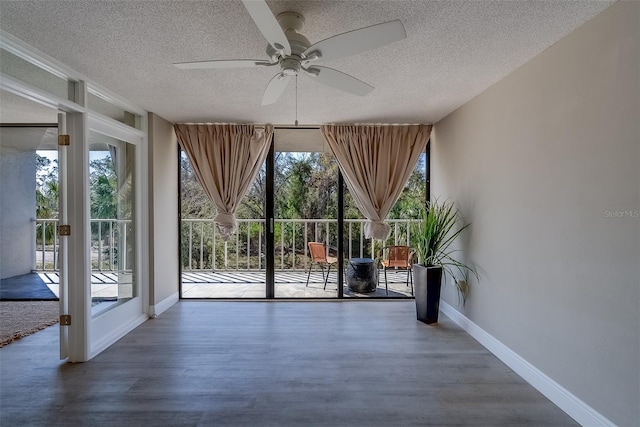 500 N Osceola Ave Unit 203, Clearwater, FL 33755 - entryway with a textured ceiling, ceiling fan, plenty of natural light, and baseboards