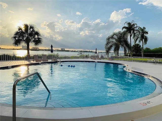 500 N Osceola Ave Unit 203, Clearwater, FL 33755 - pool at dusk with a community pool, a water view, and a patio