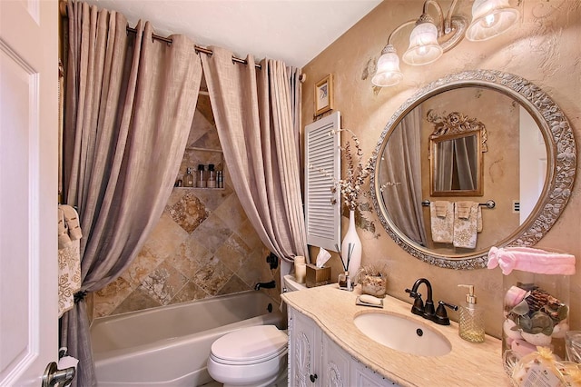 full bathroom with a textured wall, shower / tub combo with curtain, vanity, and toilet