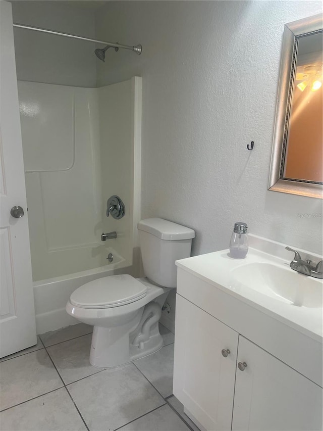 full bathroom with shower / bathing tub combination, vanity, toilet, and tile patterned floors