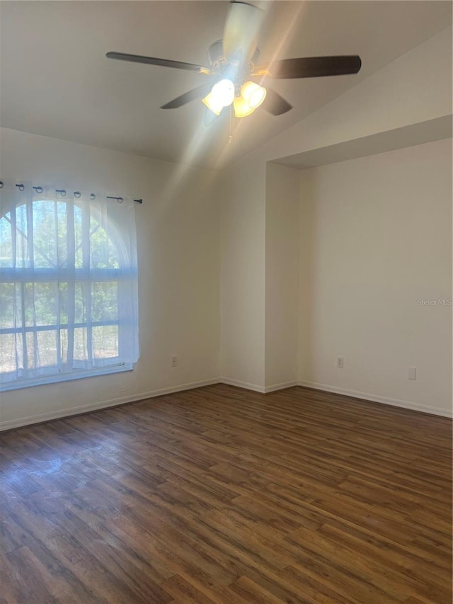 unfurnished room featuring dark hardwood / wood-style floors and ceiling fan